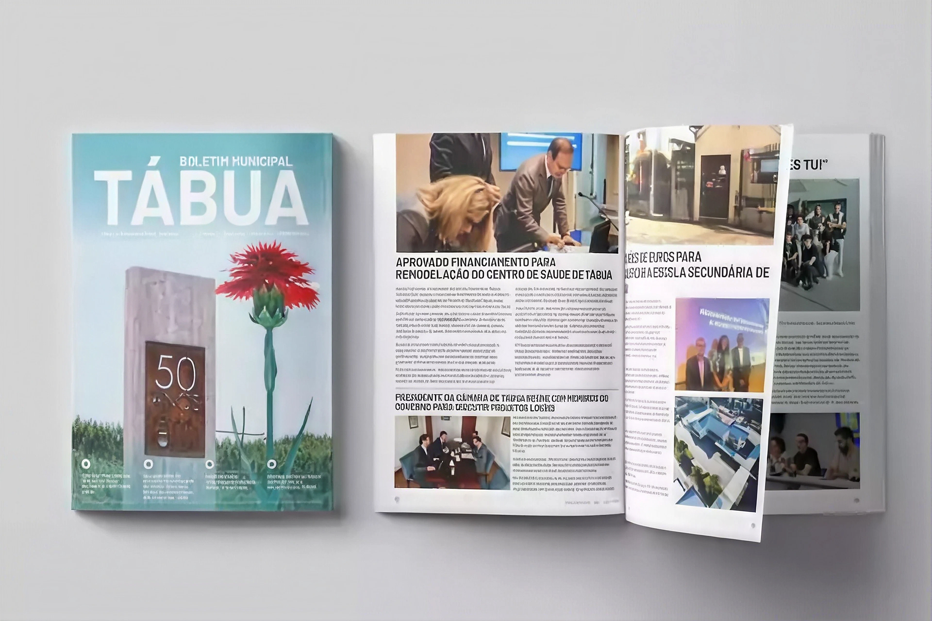 Exemplares da revista municipal de Tábua abertos sobre uma mesa